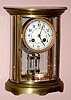 French, OVAL 4-glass crystal regulator with fancy porcelain dial and 2-vial compensating pendulum, time and gong strike, spring. C.1905.