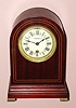 Chelsea Clock Co., for T. Kirkpatrick and Co., New York, Round Gothic mahogany timepiece, serial No. 102438, C.1915