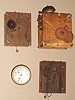 Box of 4 movements: mixed lot of two Terry type 30-hour wood shelf clock movements, French 8-day movement and dial and an Ashby type 30-hour tall clock movement.