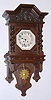 German, Mathias Bauerle, St. Georgen, Berlin style, FREE SWINGER wall clock in a dark fumed oak case with heavy barley twist columns on the door, and cast/gilt sunburst pendulum, QUARTER strike on 2 gongs, C.1890