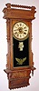 Wm. L. Gilbert Clock Co., "Sharon", 8-day time/strike McCabe patent calendar wall clock. Circa 1901