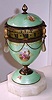 Swiss, for Austrian market, small annular dial "egg" style mantel clock, stem wind and set from side, with pastel green guilloche enamel over silver case, and with 7 little cameos, female motifs.