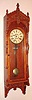 F. Kroeber Clock Co., "Regulator No. 47", in cherry, 8-day time and gong strike wall clock, case with incised Eastlake carving, C.1884.