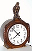 Warren Telechron Co, Ashland, Mass, a large mahogany cased 110v timepiece with cord, the case trim cut out to accept a plastic and plaster eagle on top, 16" dial C.1935
