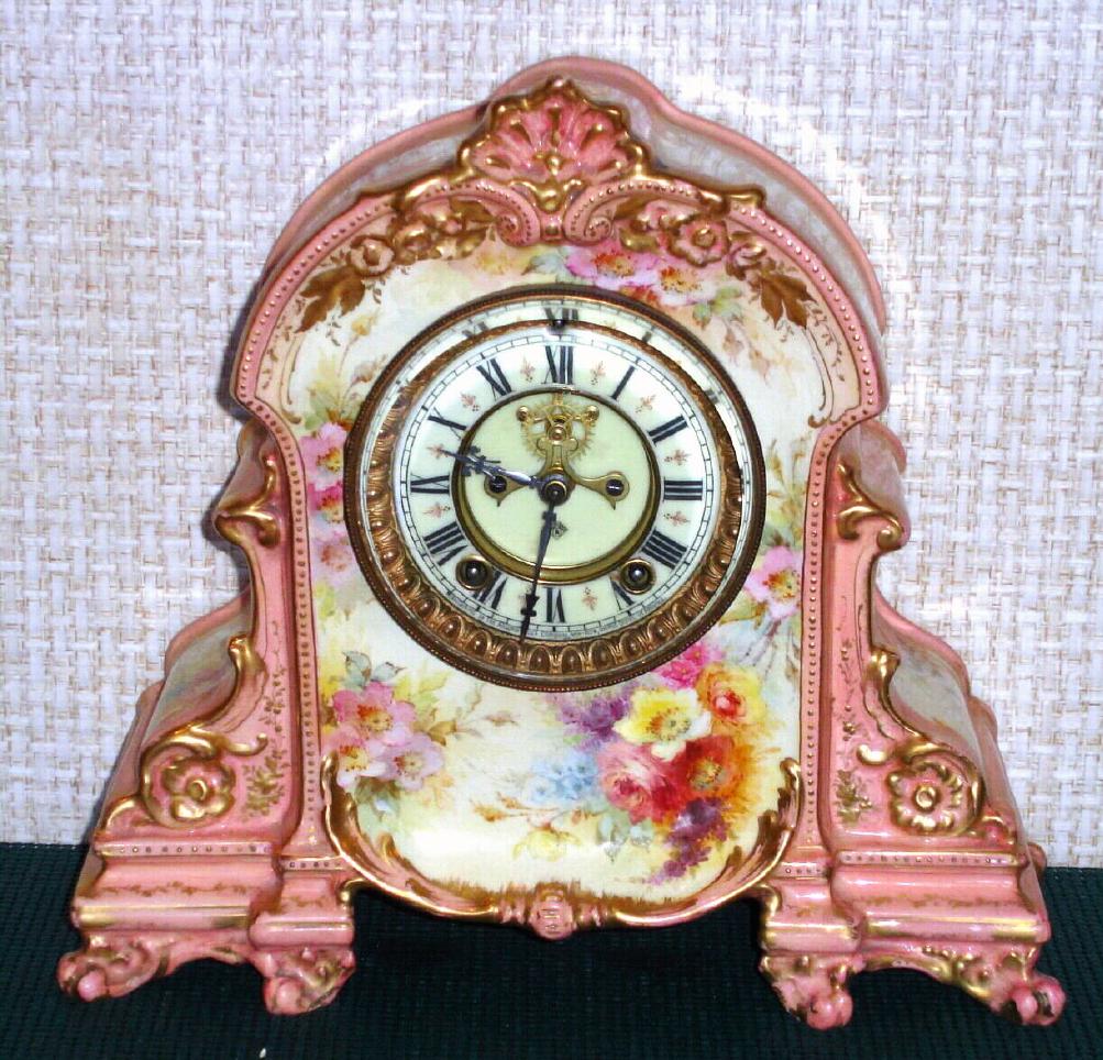 Ansonia Clock Co., C.1895, Royal Bonn, "LA TOURAINE" porcelain china cased clock, with 8-day, gong strike mov't with open escapement on porcelain dial, attractive "beige-pink" color with strong gold highlights. — Antique Clocks Price Guide