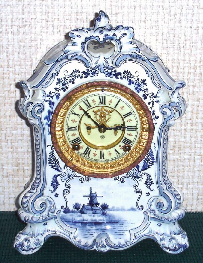 Ansonia Clock Co., C.1895, Royal Bonn, "No. 501" porcelain china cased clock, with 8-day, gong strike mov't with open escapement on porcelain dial, and the case in blue Delft pattern. — Antique Clocks Price Guide