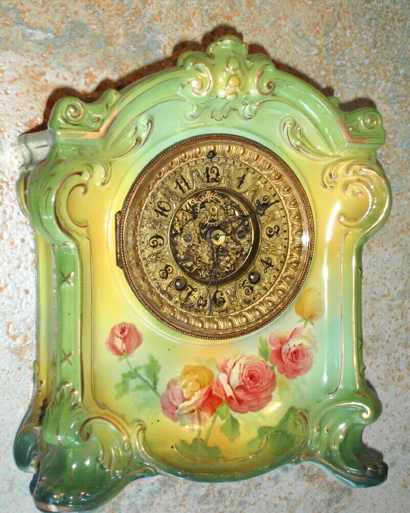 Ansonia Clock Co., C.1910, Royal Bonn, "LA SEDAN", damaged case and fancy dial (open 'scape) movement from another Ansonia clock. — Antique Clocks Price Guide