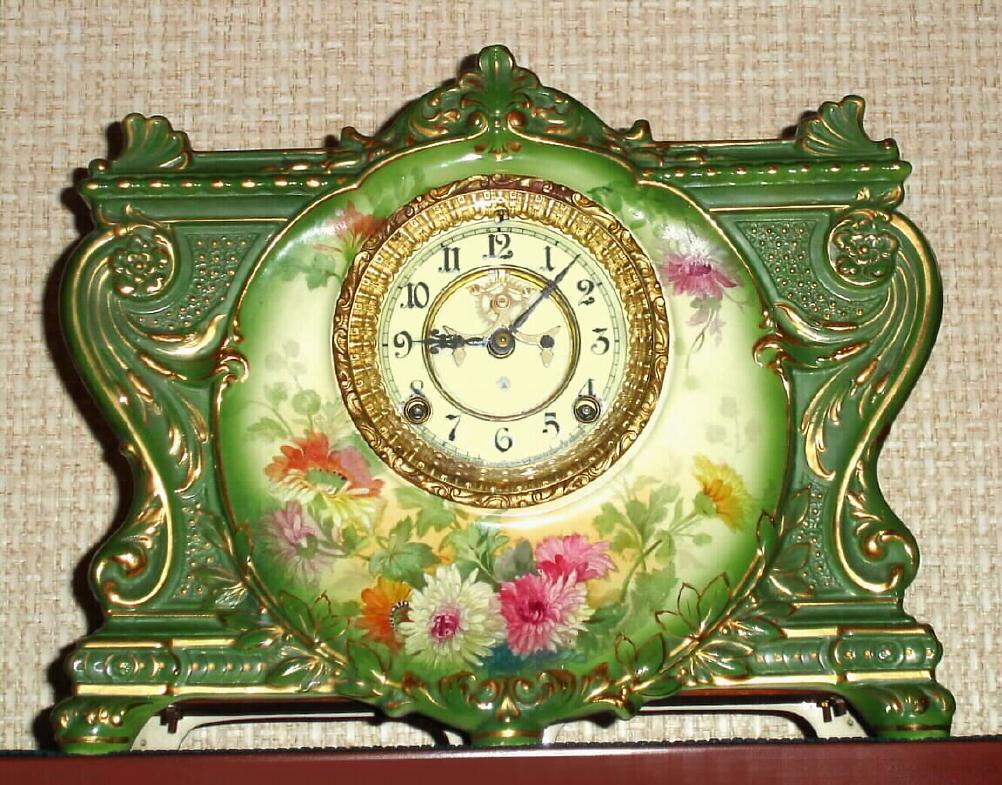 Ansonia Clock Co., Royal Bonn, "LA VINDA", green porcelain clock in the French style, with open escapement on the dial, gong strike, 8-day. — Antique Clocks Price Guide