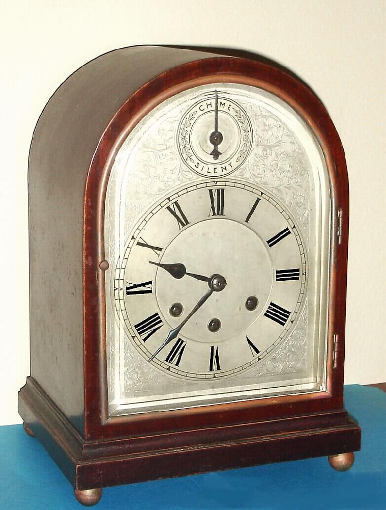 German, Gustav Becker {Freiburg / Schloss}, C.1914, WESTMINSTER chime mantel clock, with robust Becker signed movement, serial 2,387,097, in a round gothic style mahogany case. — Antique Clocks Price Guide