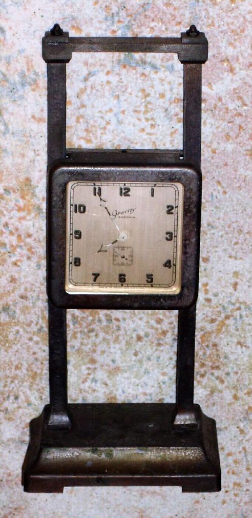 Ansonia Clock Co. New York, "GRAVITY CLOCK", 36 hour duration from top to bottom, simply raise the clock on the rack to wind. — Antique Clocks Price Guide