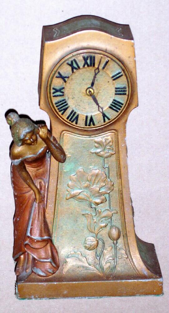 Ansonia Clock Co. New York, C.1906, "TICK TACK", one day desk novelty, cast metal with gold paint finish. Depicts a lady calling and listening for a reply. — Antique Clocks Price Guide