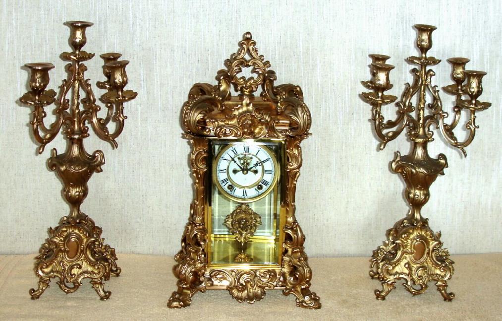 Ansonia Clock Co. New York, C.1905, "APEX and CANDELABRAS", 3-pc set, 8-day, gong strike, with open escapement on porcelain dial. — Antique Clocks Price Guide