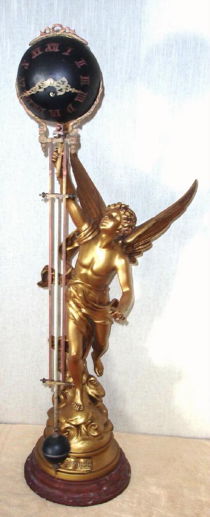 French, large Swinger, or mysterious swinging timepiece, the statue of "LE PROGRES" after the original by Bruchon, a winged male. The extra long swinging arm measures 38" — Antique Clocks Price Guide