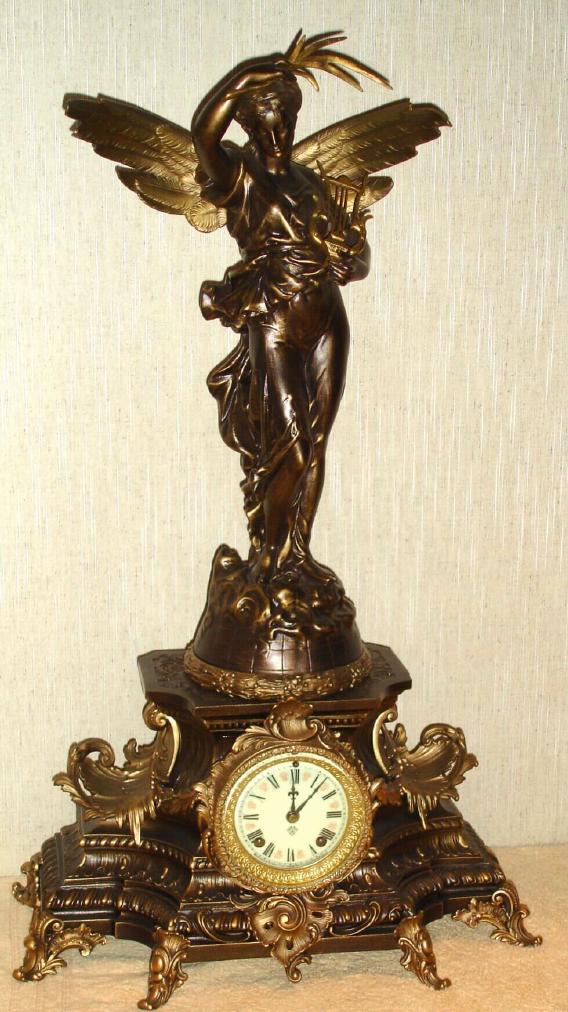 Ansonia Clock Co. New York, C.1890, "UNDINE and GLORIA", figural clock. Note this is a pictured combination in the 1904 Ansonia catalog, however, virtually any of several figures could be ordered on a given base at the time. This combination sold for $55. — Antique Clocks Price Guide