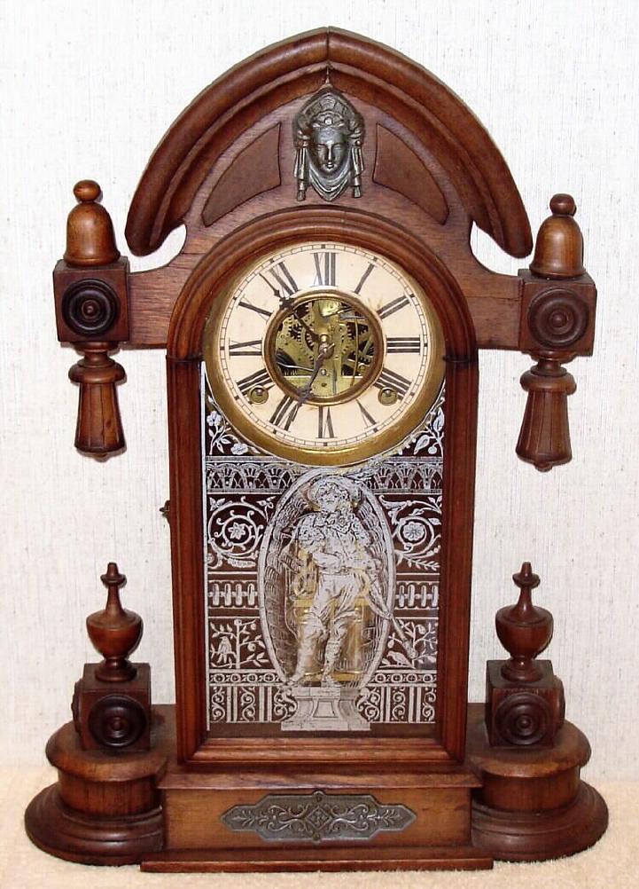 H. J. DAVIES, New York, C.1875, walnut parlor clock, the ORIENTAL, with label on back, 8-day time and strike, with double barrel pendulum {w/ Davies Patent imprint}. — Antique Clocks Price Guide