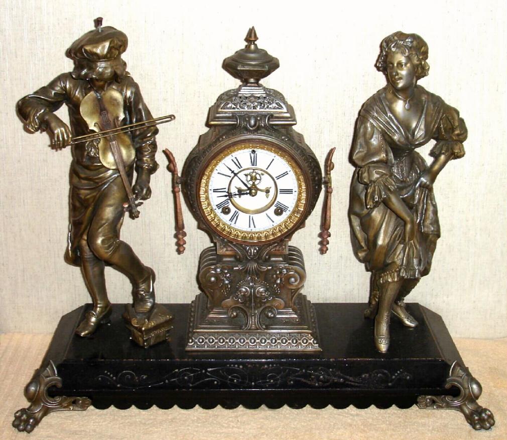 Ansonia Clock Co., New York, C.1880, "MELODY and MOTION" double statue figural clock [rare model], with open escapement on porcelain dial, gong striking, 8-day — Antique Clocks Price Guide