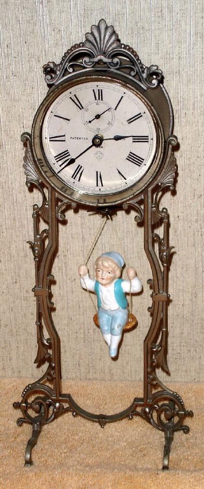 Ansonia Clock Co.., Brooklyn, New York, "JUMPER No. 2", 1-day spring novelty, with replacement doll. — Antique Clocks Price Guide