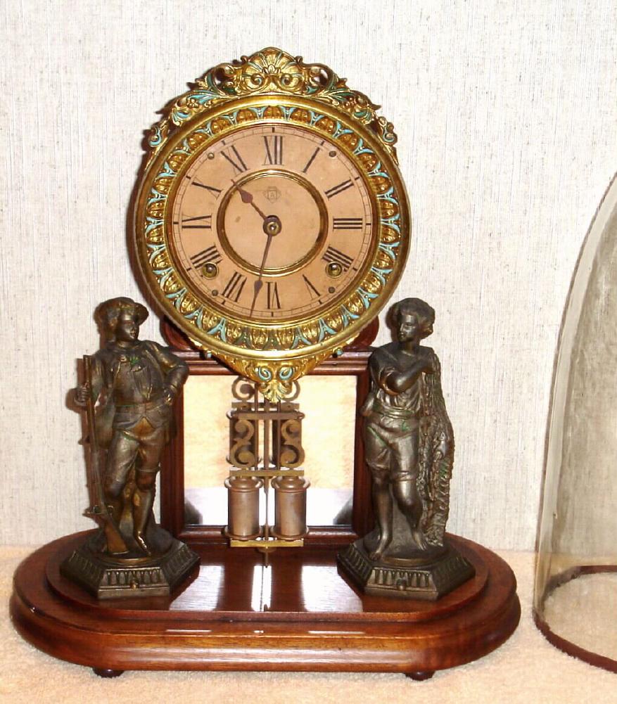 Ansonia Clock Co., Brooklyn, New York, "CRYSTAL PALACE" with dome C.1880, featuring statues of a hunter [rifleman], and a fisher with net, 8-day, bell strike. — Antique Clocks Price Guide