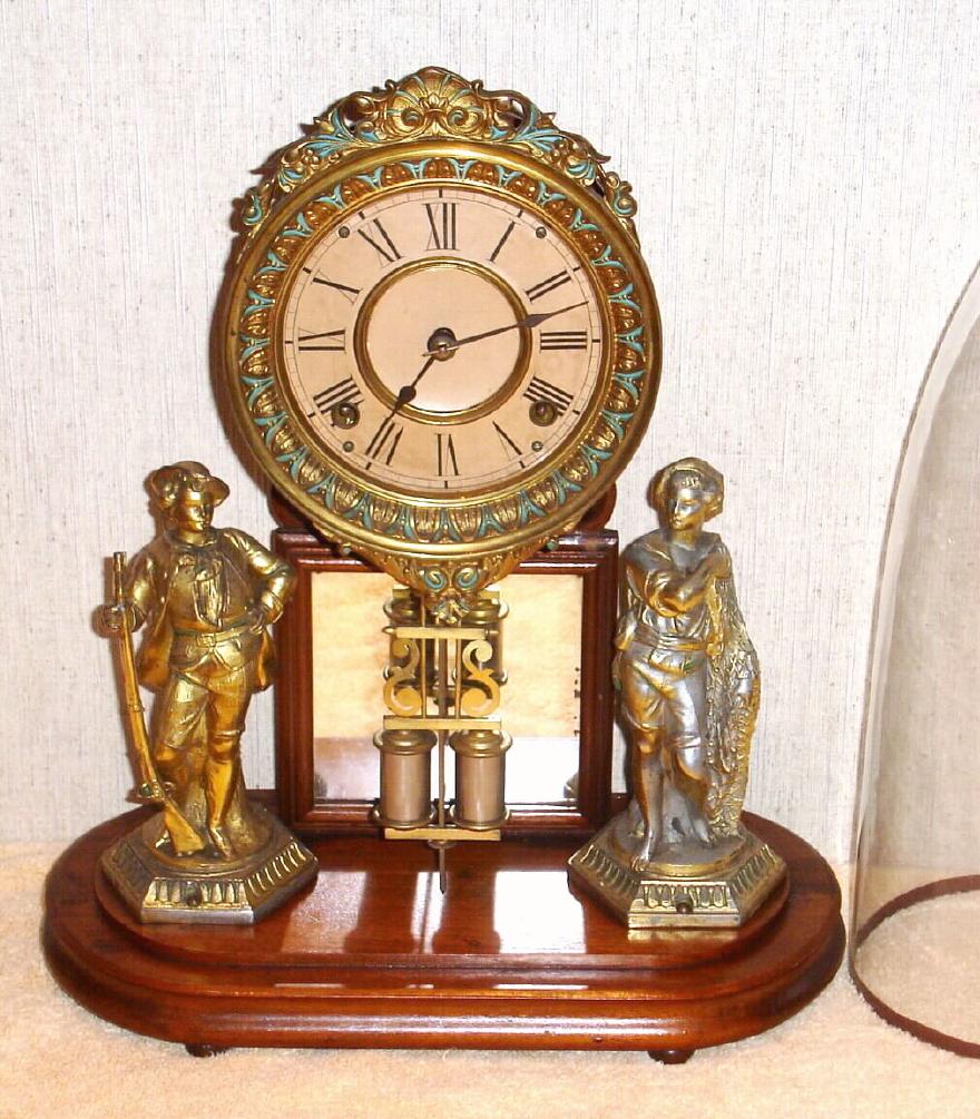 Ansonia Clock Co., Brooklyn, New York, "CRYSTAL PALACE" with dome C.1880, featuring statues of a hunter [rifleman], and a fisher with net, 8-day, bell strike. — Antique Clocks Price Guide
