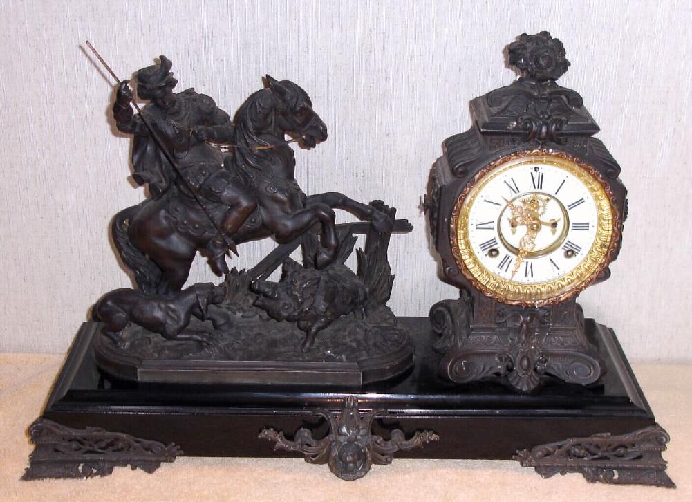 Ansonia Clock Co., New York, C.1904, "BOAR HUNTER", on later style large base, and with 8-day gong strike movement with open escapement / porcelain dial. — Antique Clocks Price Guide