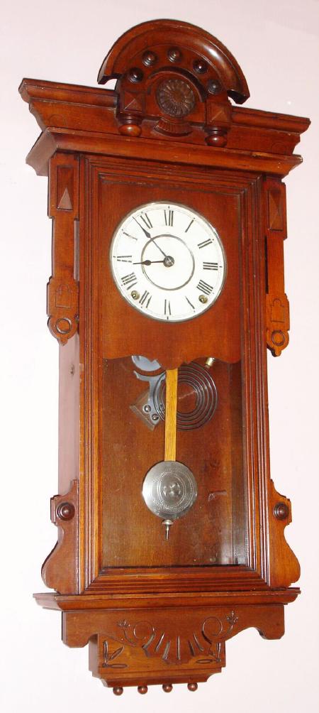 Seth Thomas Clock Co., "PANAMA", Circa 1886, 8-day spring, time/strike walnut case wall clock, uses large lyre movement with Geneva stops intact — Antique Clocks Price Guide