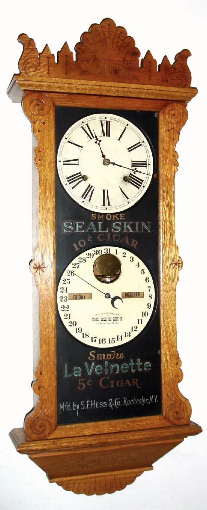 Ithaca Calendar Clock Co., "Advertising Index", Circa 1885, 8-day time/strike calendar wall clock, Smoke Seal Skin 10 cent Cigars, Smoke La Valnette 5 cent Cigars, Mfg by S. F. Hess and Co., Rochester, NY. — Antique Clocks Price Guide