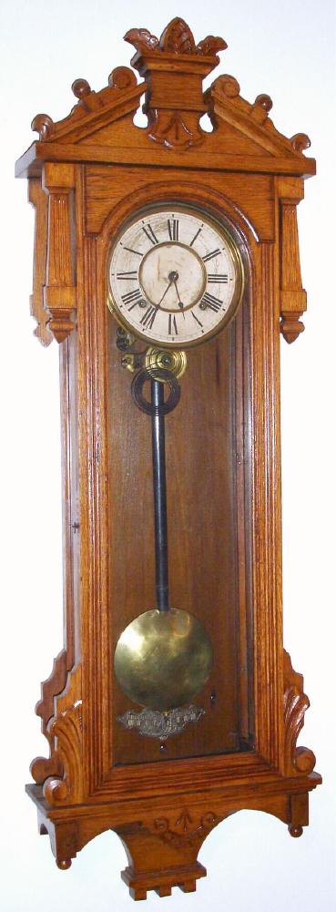 Ansonia Clock Co., "PROMPT", Circa 1901, 8-day spring, time and gong strike in an oak case with carved trim. — Antique Clocks Price Guide