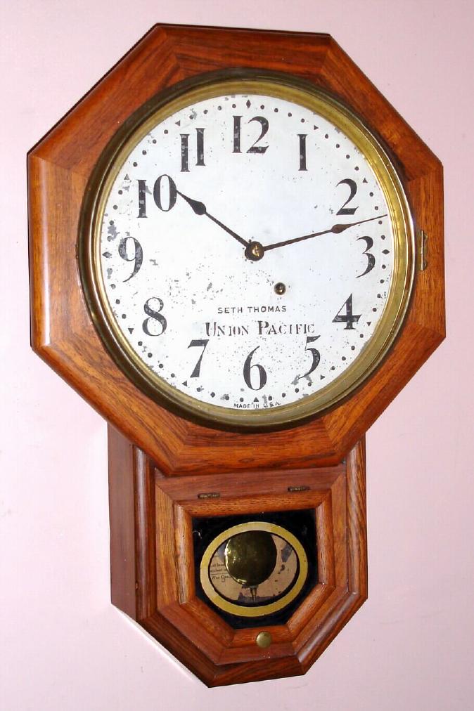 Seth Thomas Clock Co, C.1891 {dated on rear}, 12 short drop octagon, made under contract for Union Pacific Railway. Note the dial is signed Union Pacific, the label [40% missing] is special for Union Pacific, and the rear of the case is also stenciled "Union Pacific". — Antique Clocks Price Guide