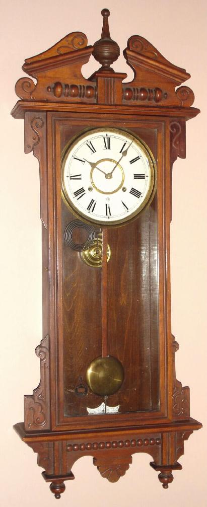Waterbury Clock Co., C.1905, "ELTON" model, walnut cased wall clock, 8-day, time and gong strike, spring. — Antique Clocks Price Guide