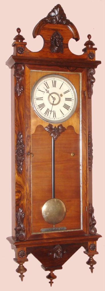 Wm. L. Gilbert Clock Co., . 1875, "REGULATOR No. 3", in rosewood, 8-day, weight driven timepiece, in a fancy Victorian case designed after popular Austrian wall clocks of the time. — Antique Clocks Price Guide