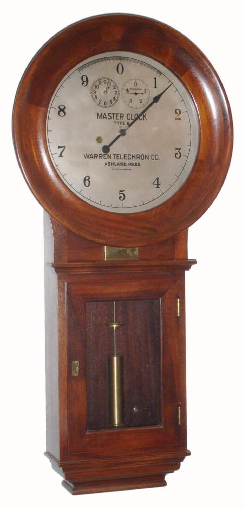 Warren Telechron Co., Ashland, Mass, C. 1925, "Warren 'B' Master Clock", (No. 127 Frequency Clock), in a walnut case, and silvered dial, 110v motor combined with quality spring mov't. Spring mov't moves the center hand backwards; electric mov't moves it forward. Cord was disconnected after checking. It is inside case. Note that you should attach cord and just plug it in; there is NO need to ever wind it again. An additional note is if you stop the pendulum and leave the electric motor running, it can strip off the 'scape teeth {something has to give}. — Antique Clocks Price Guide