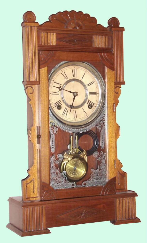 Wm. L. Gilbert Clock Co., Winsted, Conn. "CALPE" model 8 day time and strike spring driven mvt in walnut case with nickel plated 6" pan dial, c1885 — Antique Clocks Price Guide