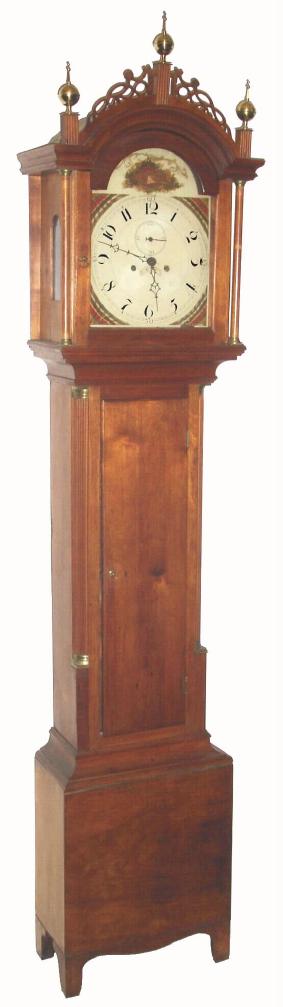 New Hampshire, 8-day, 2-wt tall clock, C.1820, probably by either James C. Cole or Benj. Morrill of Boscawen, in a heavy birch case with reeded side columns w/ brass capitals, and a hood with full turned columns flanking the dial, and surmounted by pierced frets. — Antique Clocks Price Guide