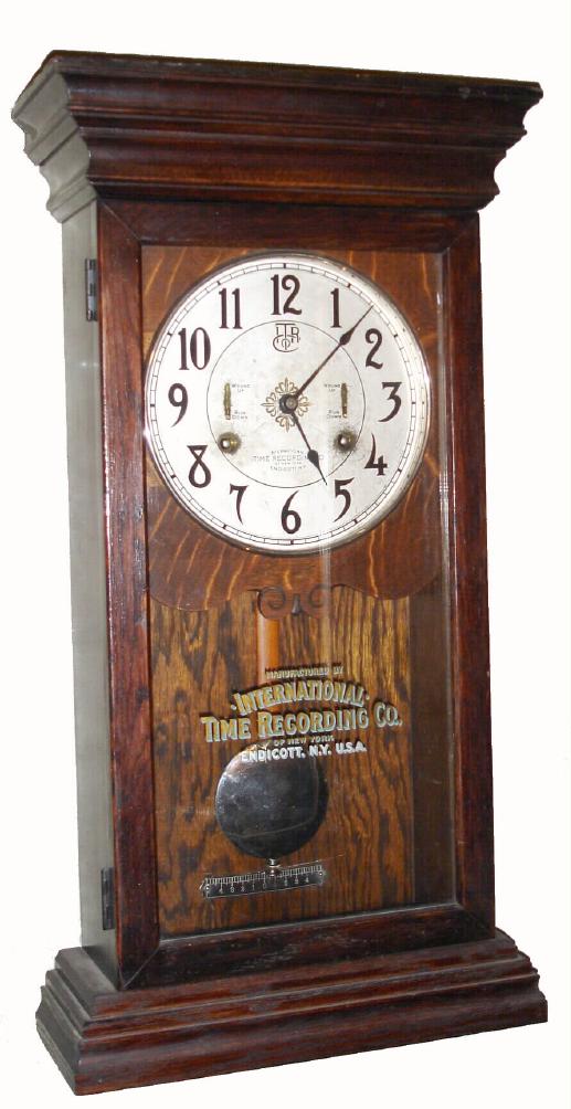 International Time Recording Co., Endicott, N.Y., heavy duplex time only mvt with no recorder in walnut case with AN metal dial and two wind indicators, c1920 — Antique Clocks Price Guide