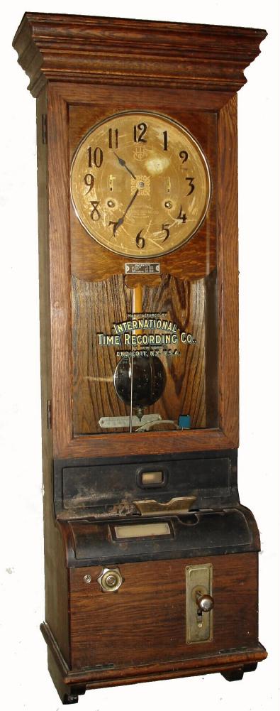 International Time Recording Co., Endicott, N.Y., heavy duplex time only mvt with original day and time, punch card recorder in walnut case with Arabic numeral metal dial and two wind indicators, c1920 — Antique Clocks Price Guide