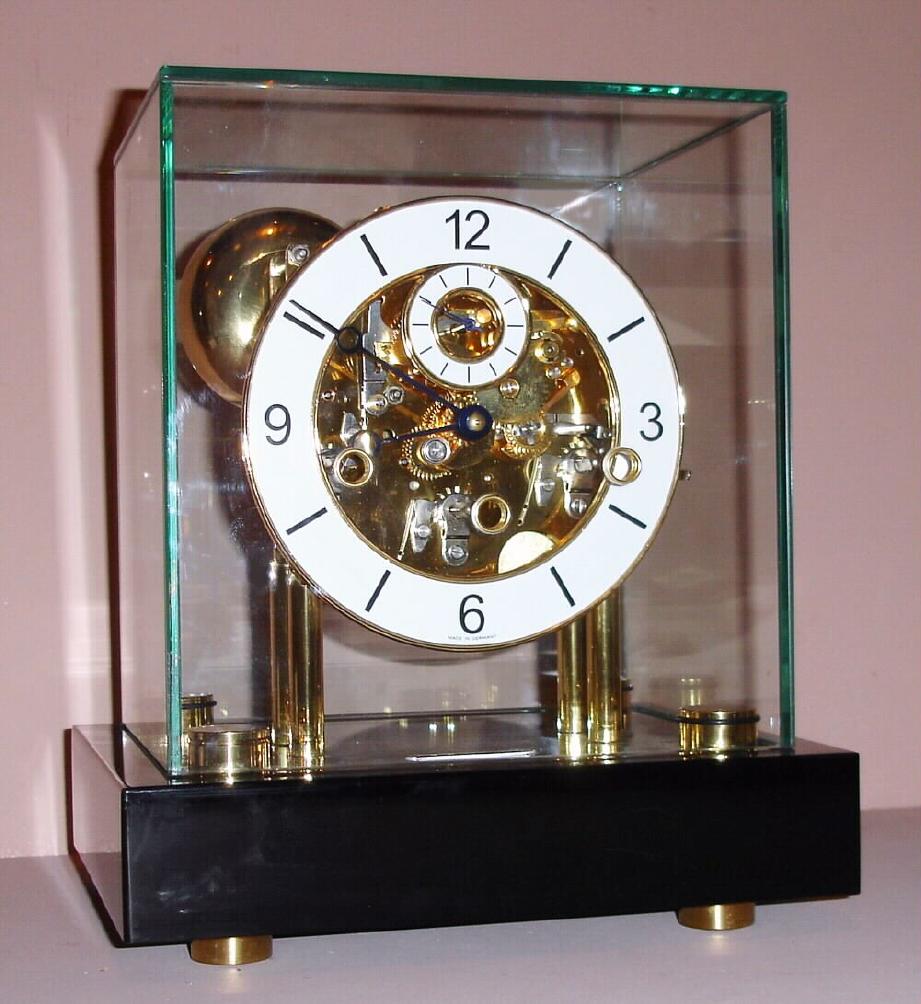 Franz Hermle Germany skeletonized mantle clock with 8 day time and strike 11J gilt spring driven mvt striking the hours and chiming the quarter hours on nest of four bells with Arabic numeral chapter ring, c1990 — Antique Clocks Price Guide