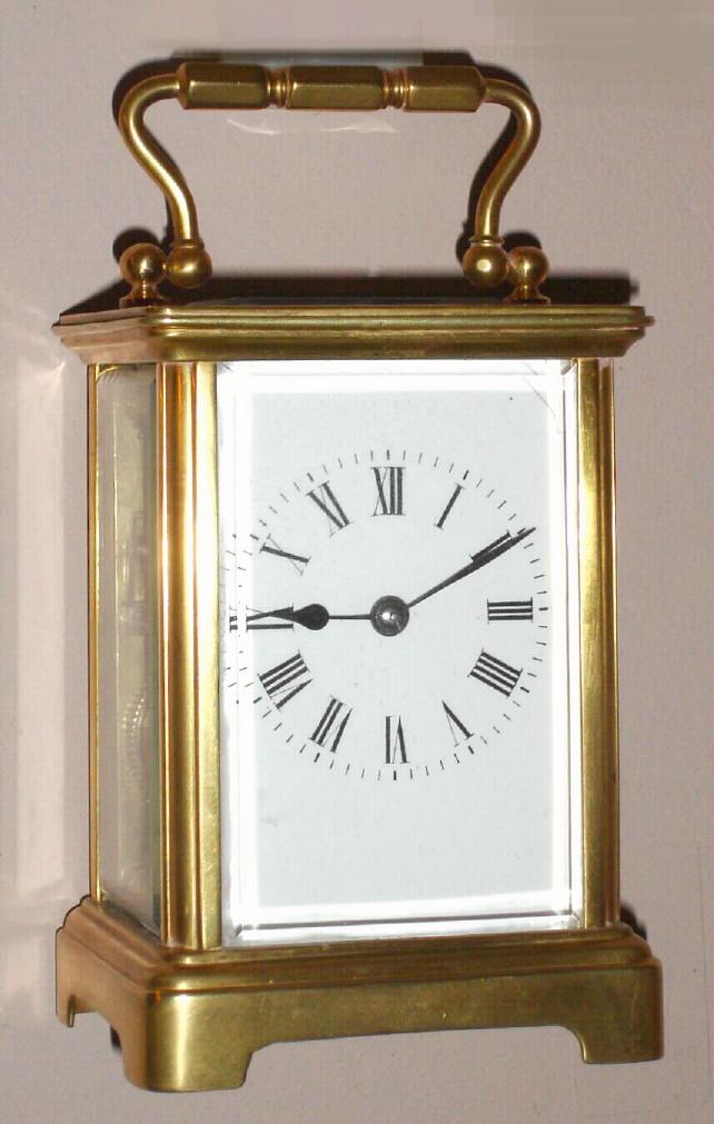 French carriage clock time and half hour strike on gong in corniche case with Roman numeral porcelain dial, c1910 — Antique Clocks Price Guide