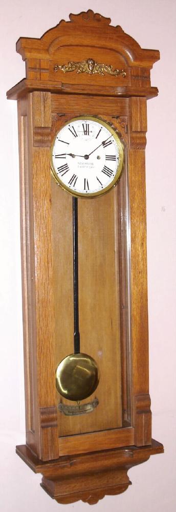 New Haven Clock Co., New Haven, Conn. "COLUMBIA" model wall clock 30 day timepiece, using rugged double wind New Haven mov't, with Roman numeral 8" gilt pan dial, c1911 — Antique Clocks Price Guide