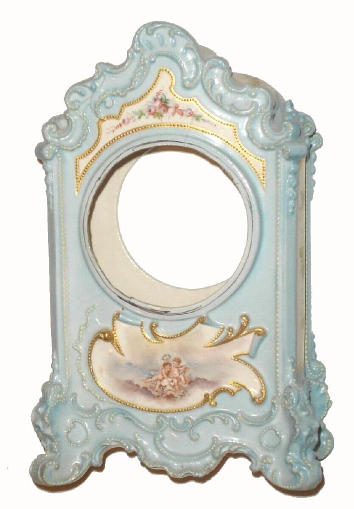 Case only, French, Porcelain china with hand painted floral decorations on the sides, and an accented transfer of cherubs below the dial opening of 4", light powder blue in color. — Antique Clocks Price Guide