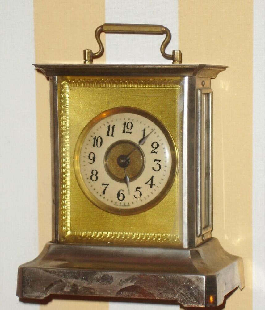 German, Badische Uhrenfabrik, c.1900, musical alarm clock, 1-day, back wind and set, with small cylinder box in the base. — Antique Clocks Price Guide