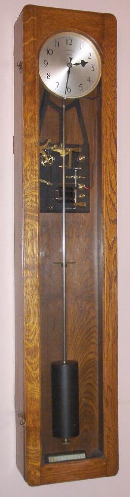The Synchronome Co., Ltd, London, England, {factory in Alperton}, c.1925, electro mechanical master clock, meter pendulum, in a quarter sawn oak case — Antique Clocks Price Guide