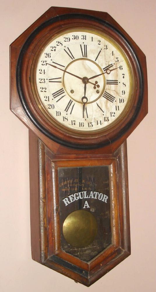 Ansonia Clock Co., Regulator A with calendar, time and gong strike, in a walnut case, as-found. — Antique Clocks Price Guide