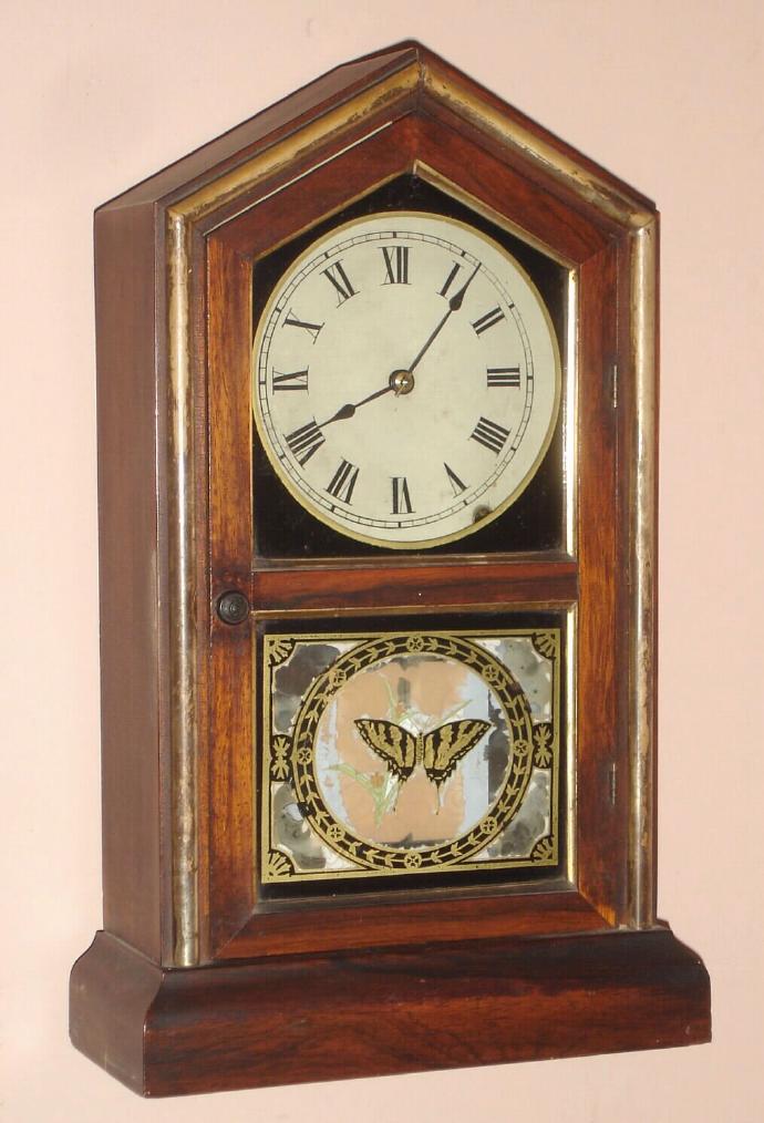 Jerome and Co., (New Haven), "TUSCAN", C.1880, 8-day time and strike gothic style mantel clock with gilt wood accents to the rosewood case. — Antique Clocks Price Guide
