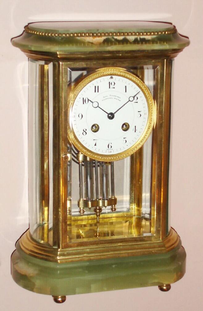 French, Japy Freres Paris crystal regulator retailed by John Wanamaker Philadelphia - New York 8 day time and strike spring driven mvt stamped 'MADE IN FRANCE' and also stamped with Japy Freres and John Wanamaker marks in brass case on onyx base with bun feet and onyx top with beaded accent. The Arabic numeral porcelain dial with gilded engine turned bezel, has retailers name. Two vial (mercury) pendulum is orig and intact, c1900 — Antique Clocks Price Guide