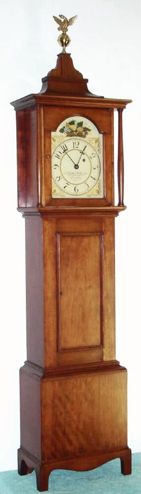 Reproduction dwarf tall case, in the style of Joshua Wilder, Hingham, Mass and with his name and town applied to the dial, C.1980, cherry case with turned columns flanking the dial. — Antique Clocks Price Guide