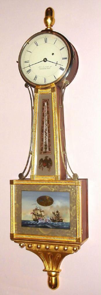 T. E. Burleigh Jr., Winchester, Mass., reproduction presentation banjo timepiece with time only weight driven movement in mahogany case with gilt rope front and reverse painted tablet depicting the ship's United States and Macedonian in a gun battle from the War of 1812 with Roman numeral painted dial, c1980 — Antique Clocks Price Guide