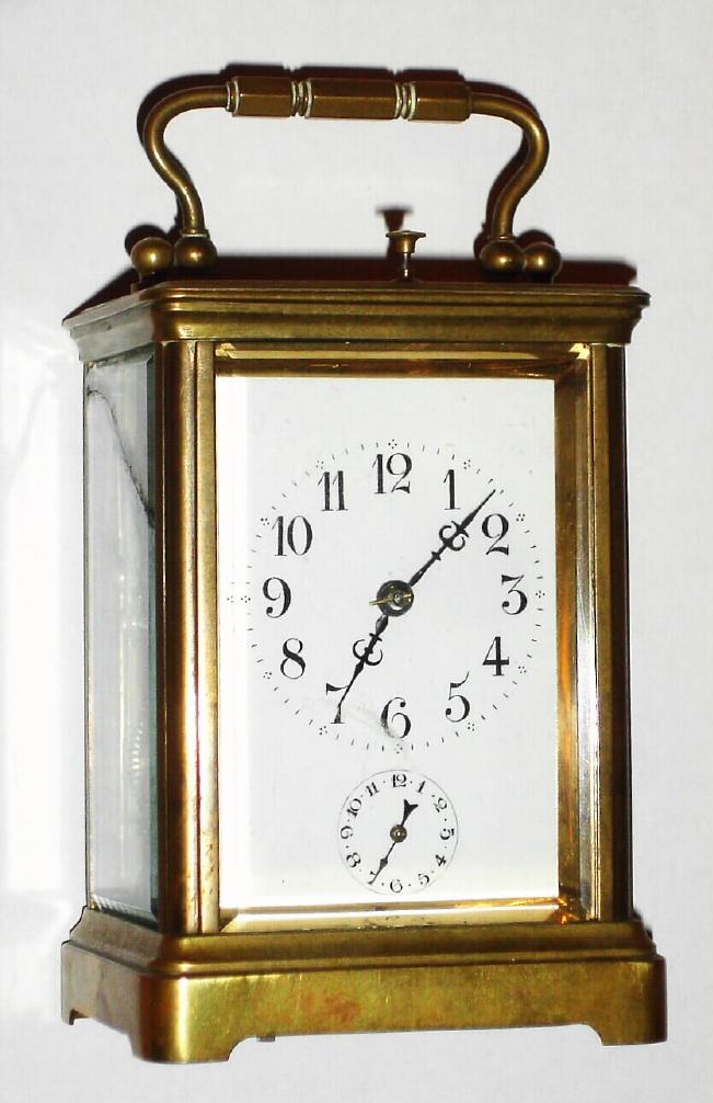 French, Brass Cased Carriage Clock, Petite Sonnerie [strikes ding dong quarters and repeats quarters and hours, with a silence lever in the base], also w/ alarm, top bearing a presentation engraved for year 1904, and with carry case w/ latched lid. — Antique Clocks Price Guide