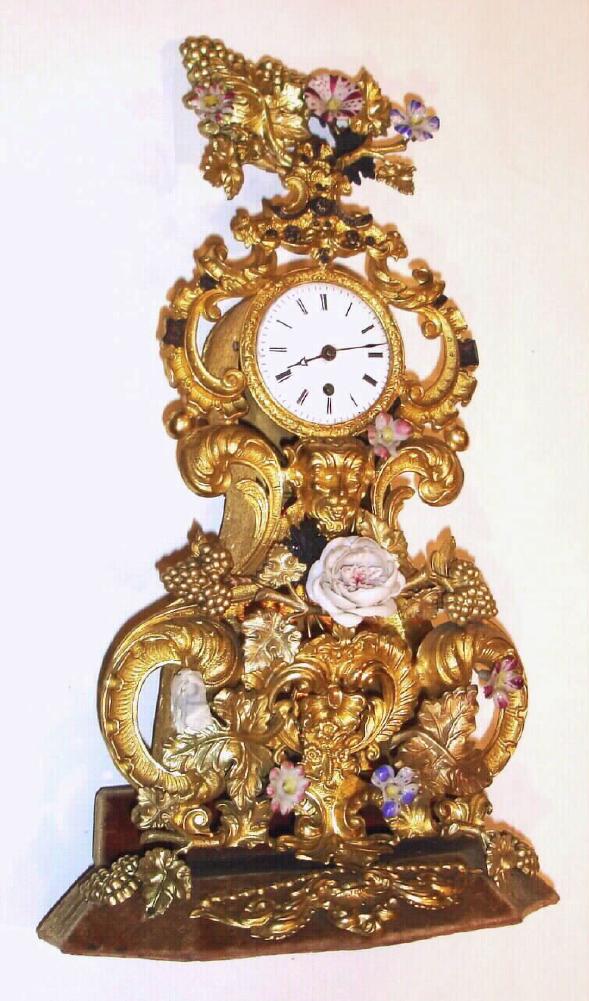 French, small repousse with porcelain flowers, fantasy timepiece, mov't signed Jeanperin, a'Paris with Roman numeral porcelain dial, sNo. 7701 c1850 — Antique Clocks Price Guide