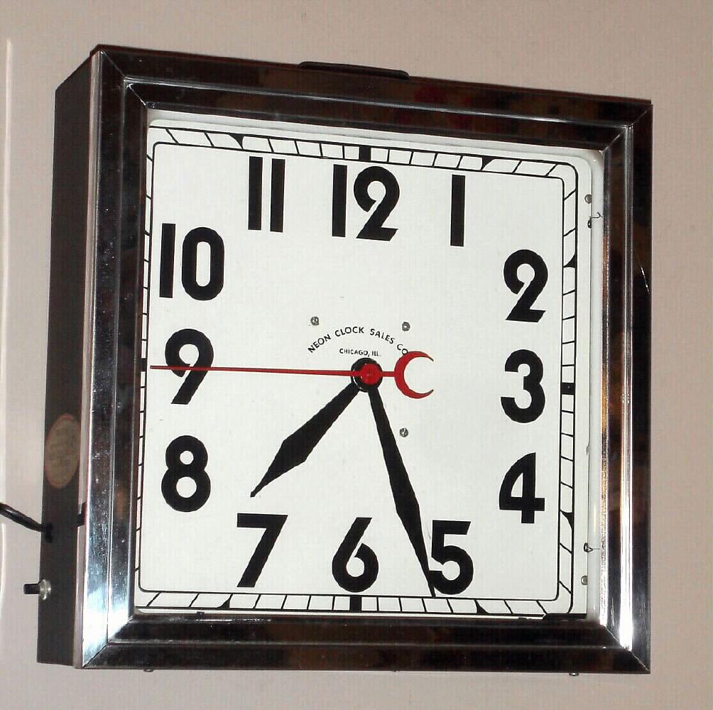 Neon Clock Sales Co. Chicago, Ill. advertising clock with electric Synchron movement in painted sheet metal case with chrome bezel and Arabic numeral dial with sweep seconds hand and reddish / pink neon lights, c1960 — Antique Clocks Price Guide