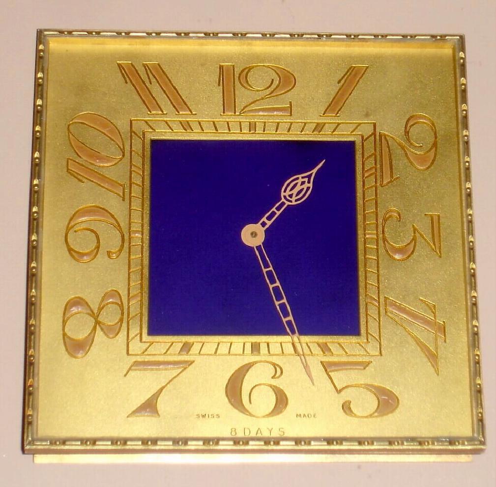 Swiss 8 day spring driven Art Deco desk clock in square gilt frame with blue enamel center, c1920, No. 81 on case — Antique Clocks Price Guide